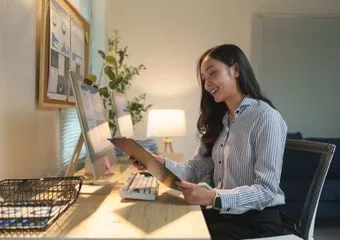 A Healios colleague reviewing notes at a desk